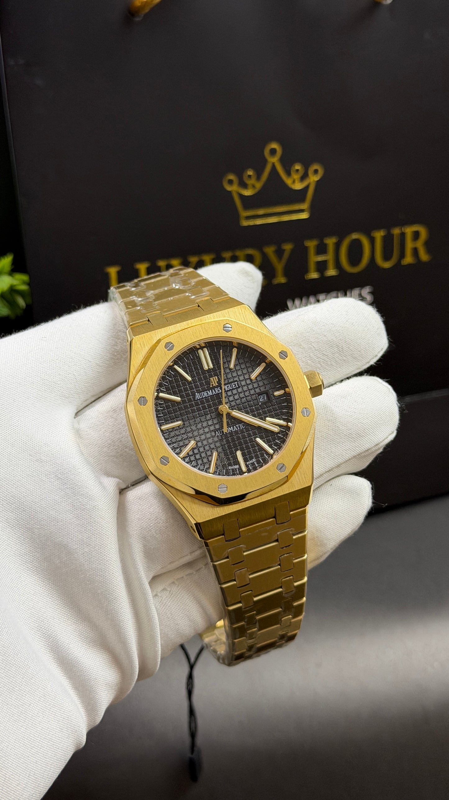 Yellow Gold with Black Dial.
