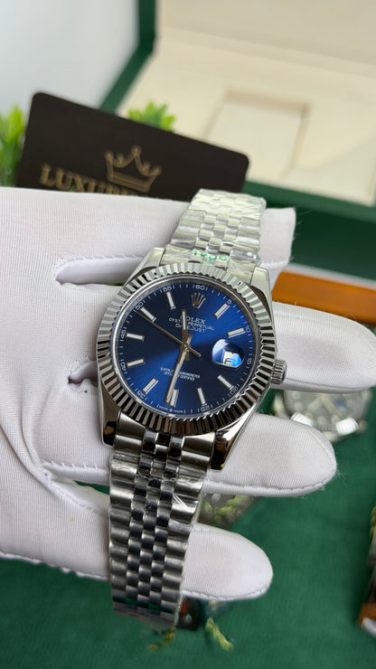Silver with Blue Dial.