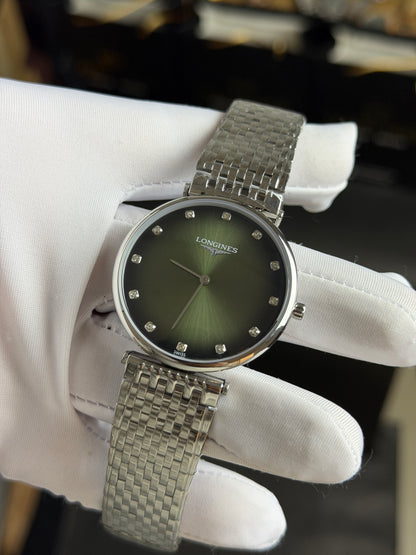 Silver with Green Dial.