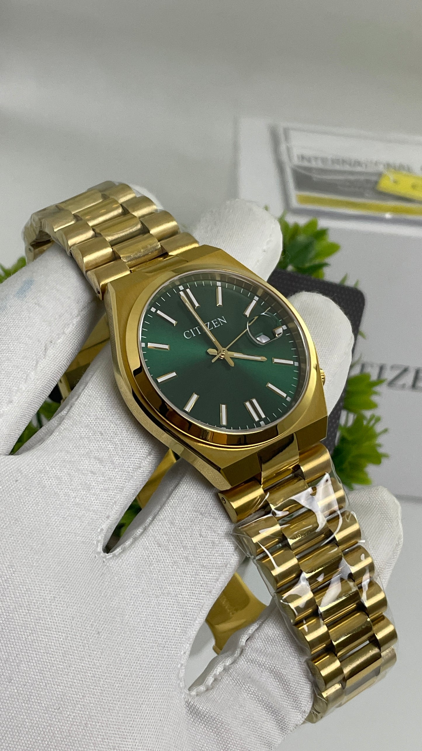 Yellow Gold with Green Dial.