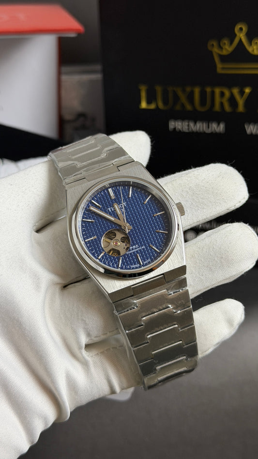 Silver with Blue Dial.