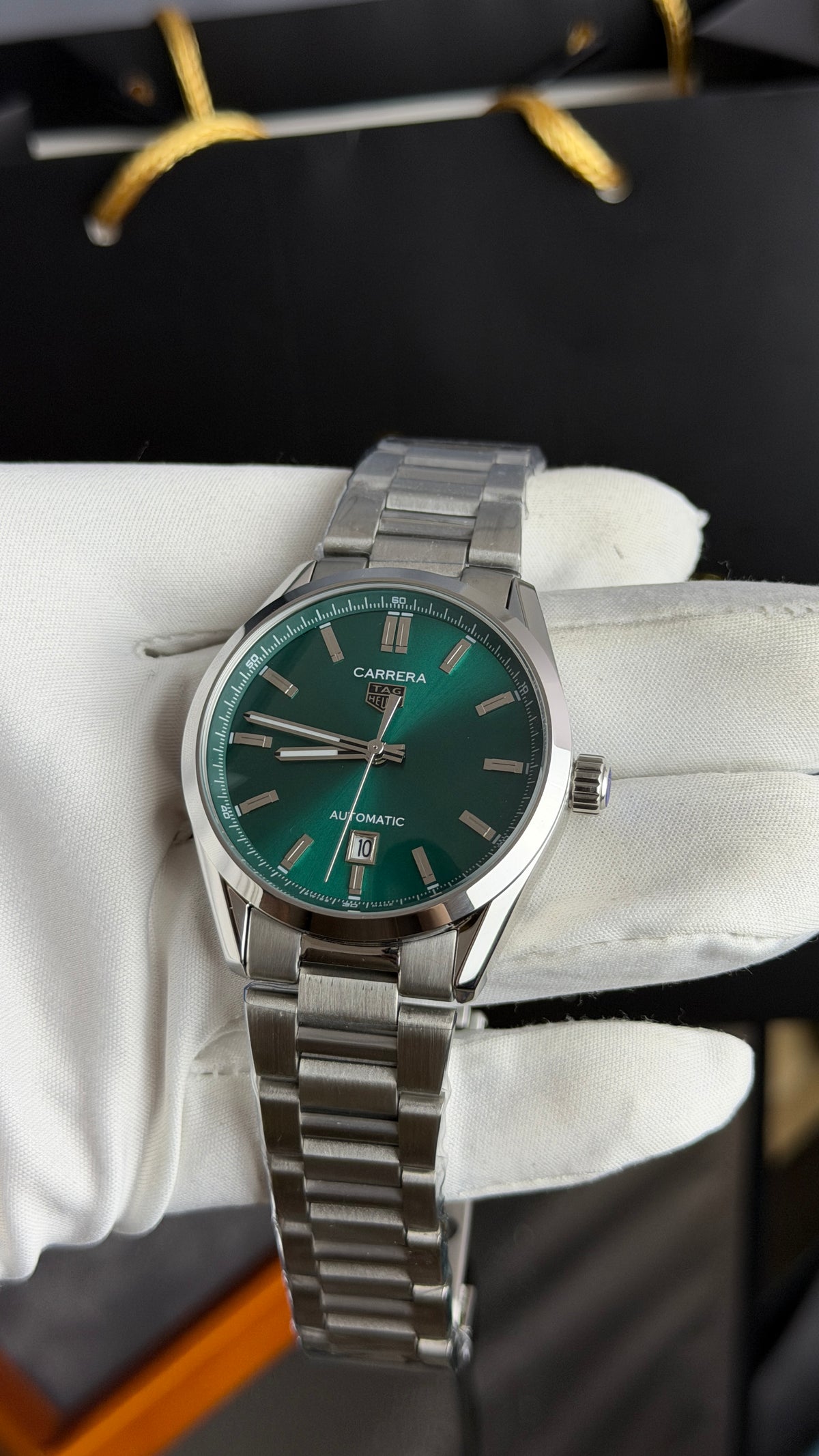 Silver with Green Dial.
