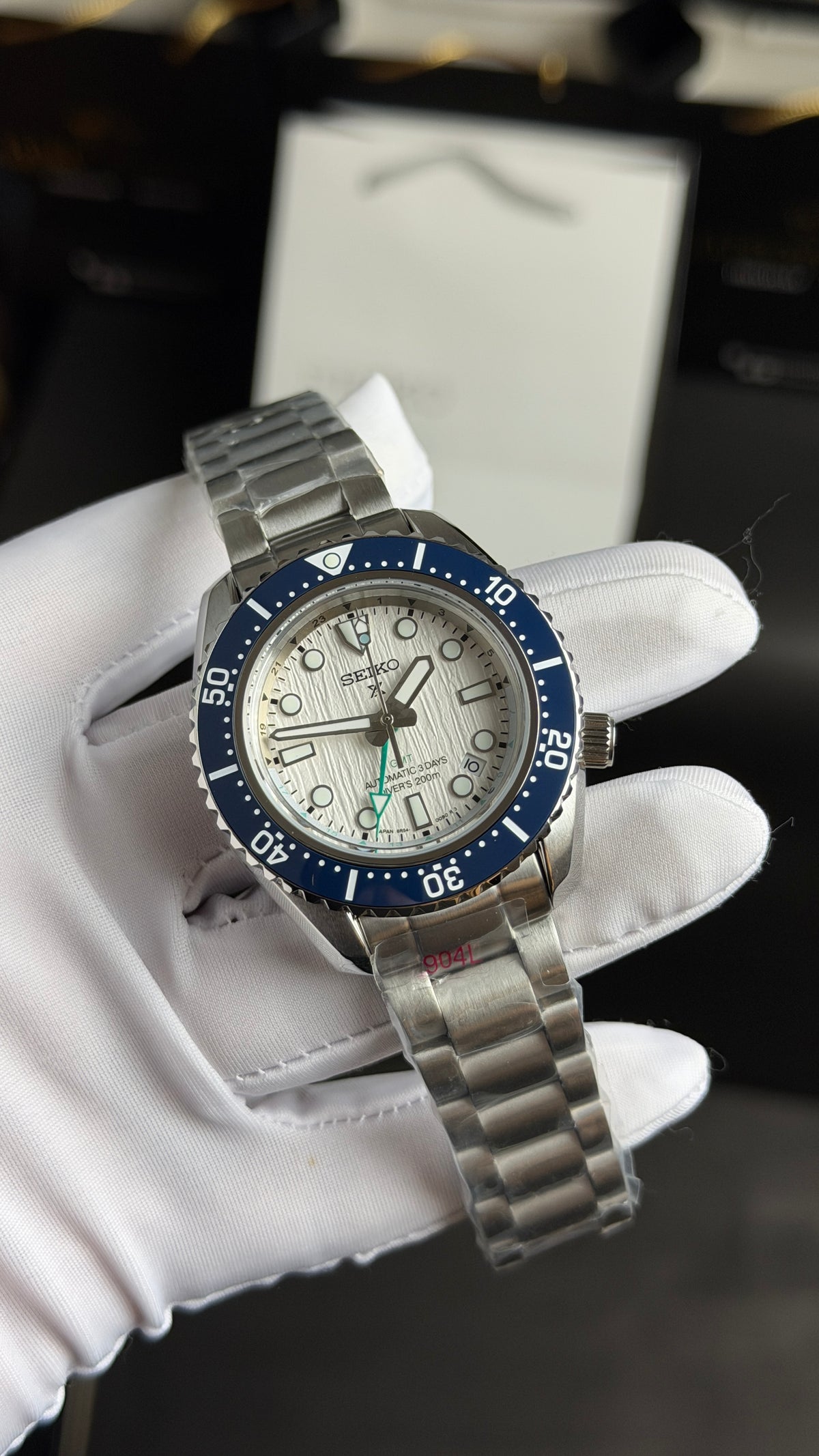Silver with White Dial.