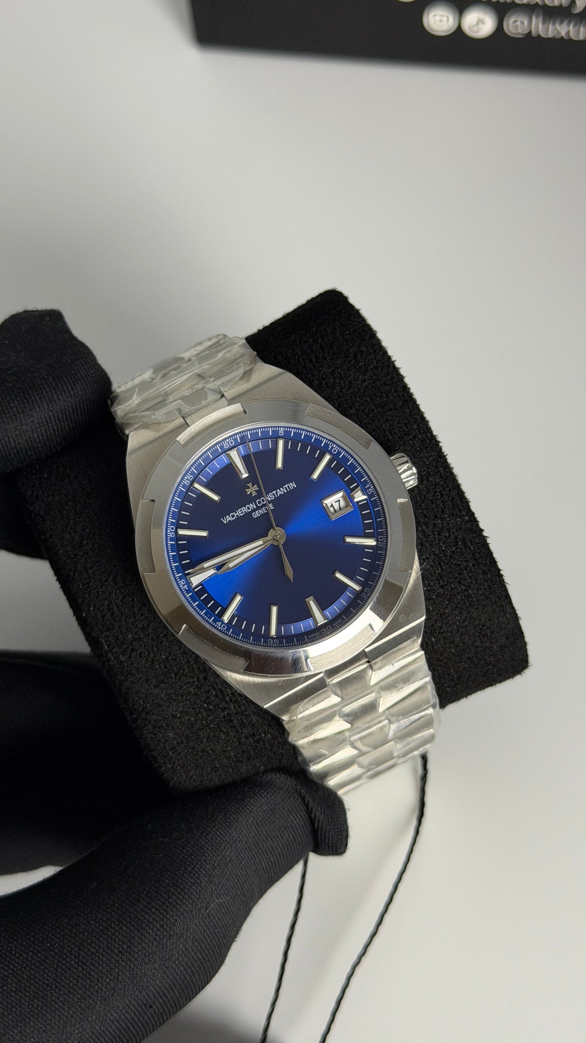Silver with Aqua Dial.