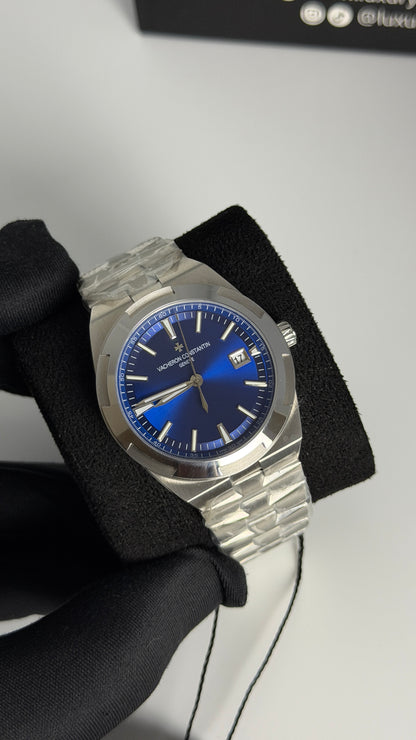 Silver with Aqua Dial.