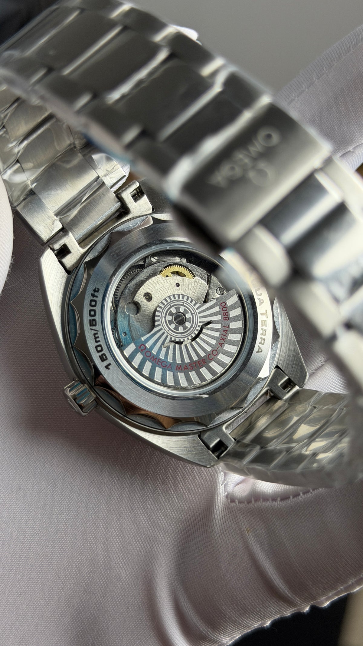 Silver with Aqua Dial.
