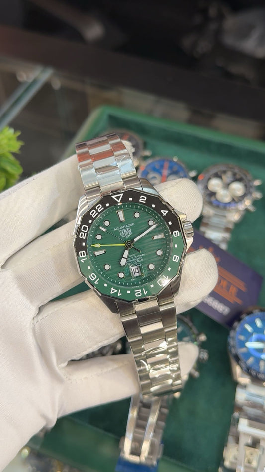 Silver with green dial