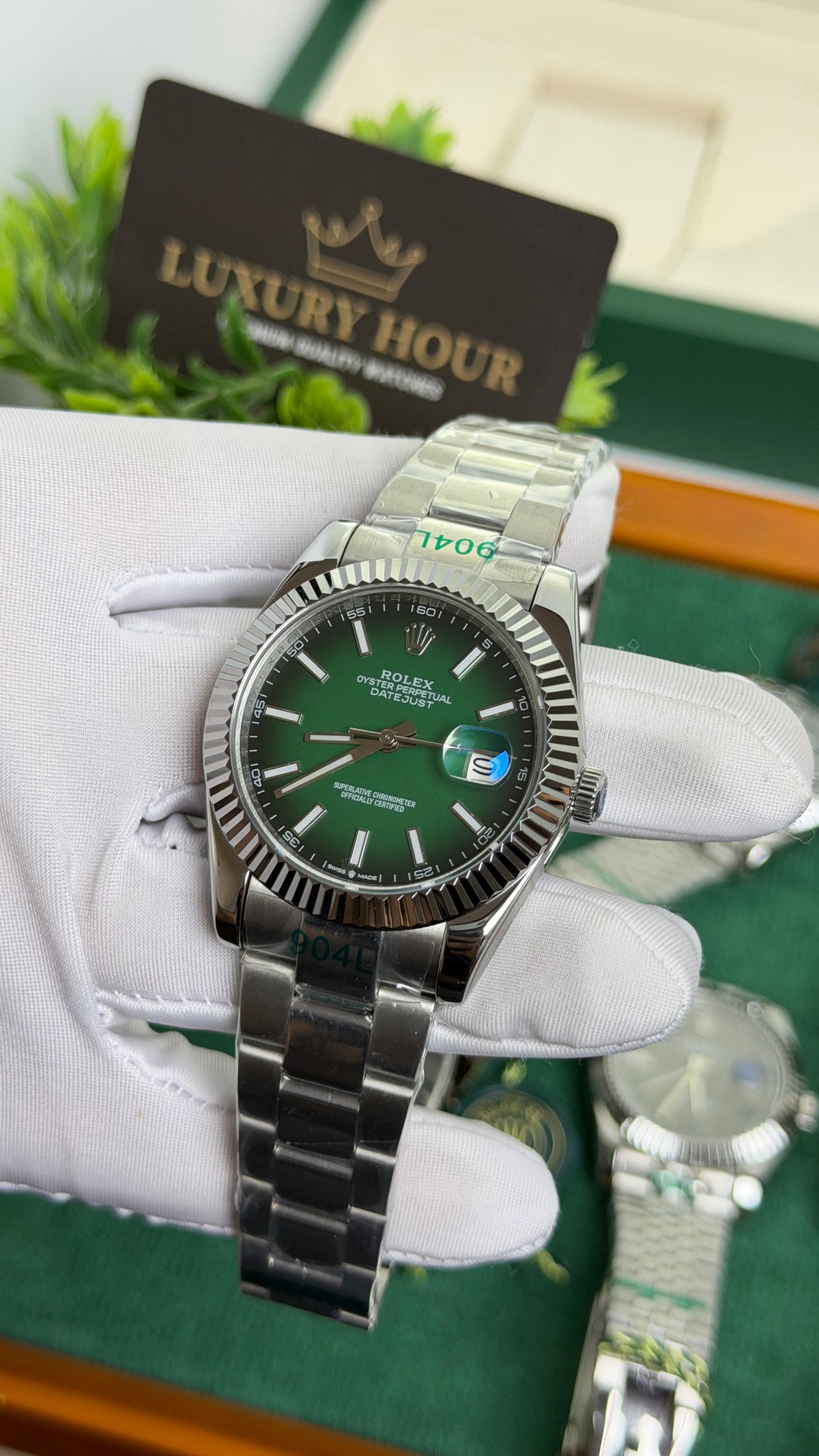 Silver with Green Dial.