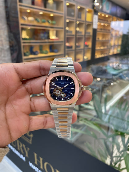 Rose gold two tone with blue dial