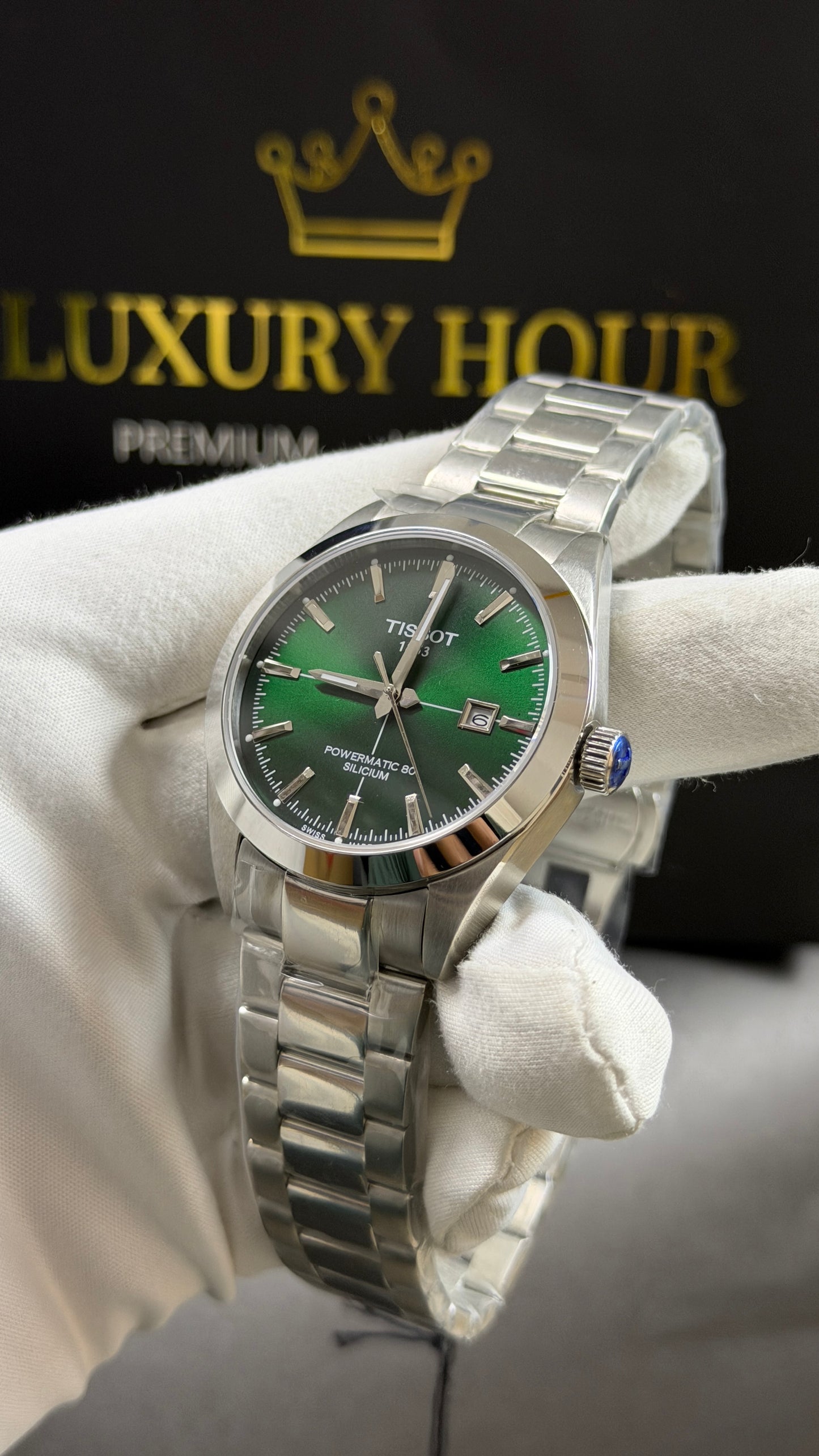 Silver with Green Dial.