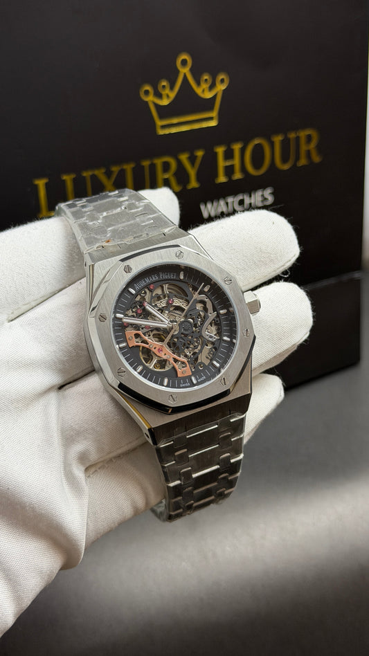 Silver with Black Skeleton Dial.