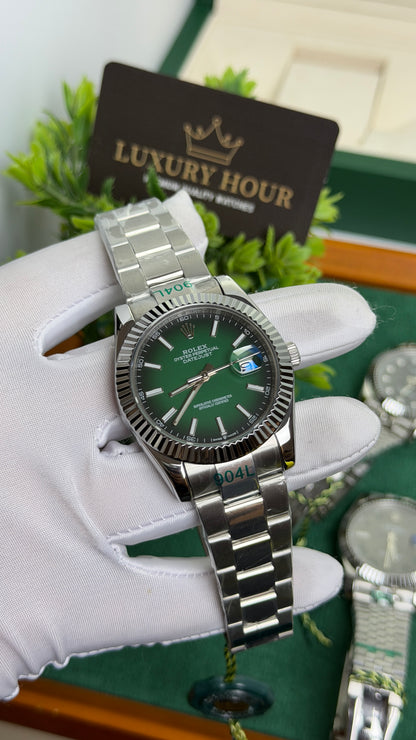 Silver with Green Dial.