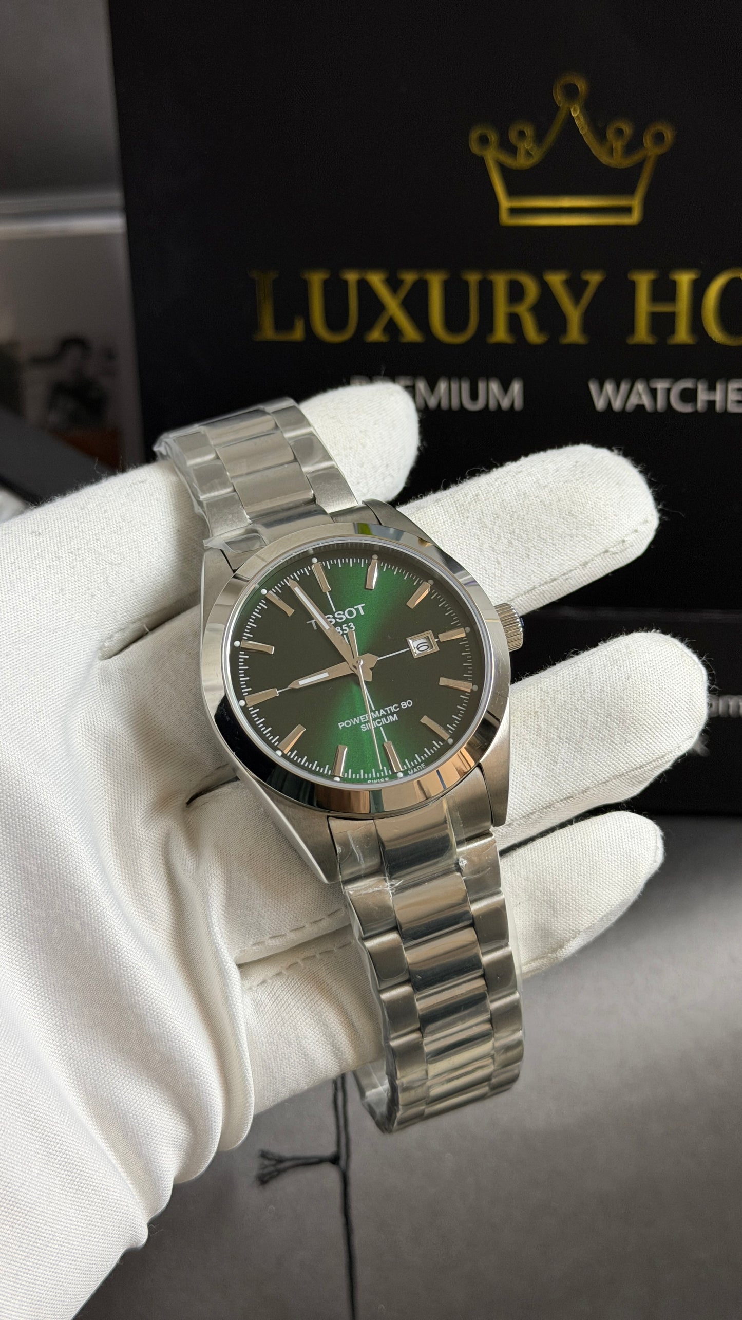 Silver with Green Dial.