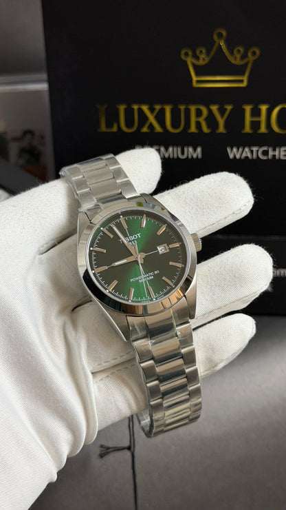 Silver with Green Dial.