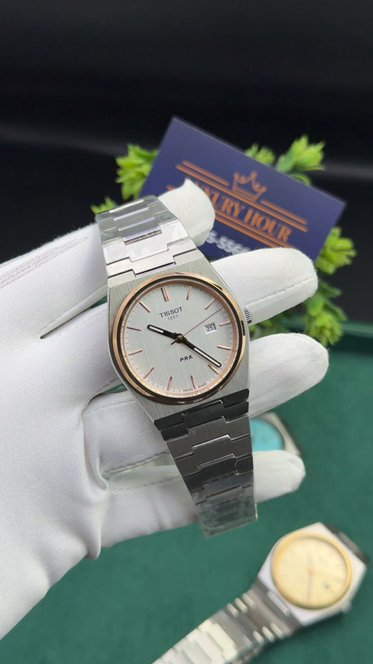 Silver with white dial & rose gold bezel.