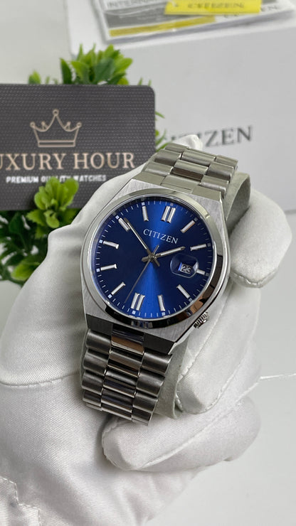 Silver with Aqua Dial.