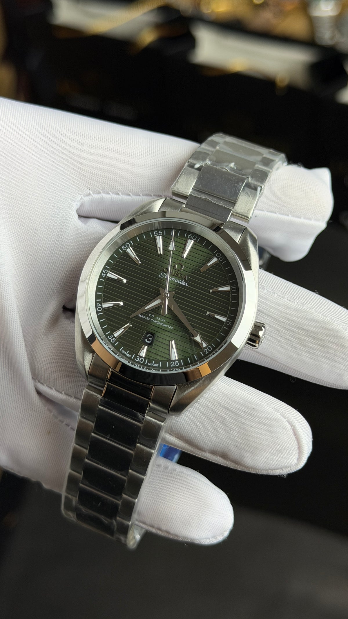 Silver with Green Dial.