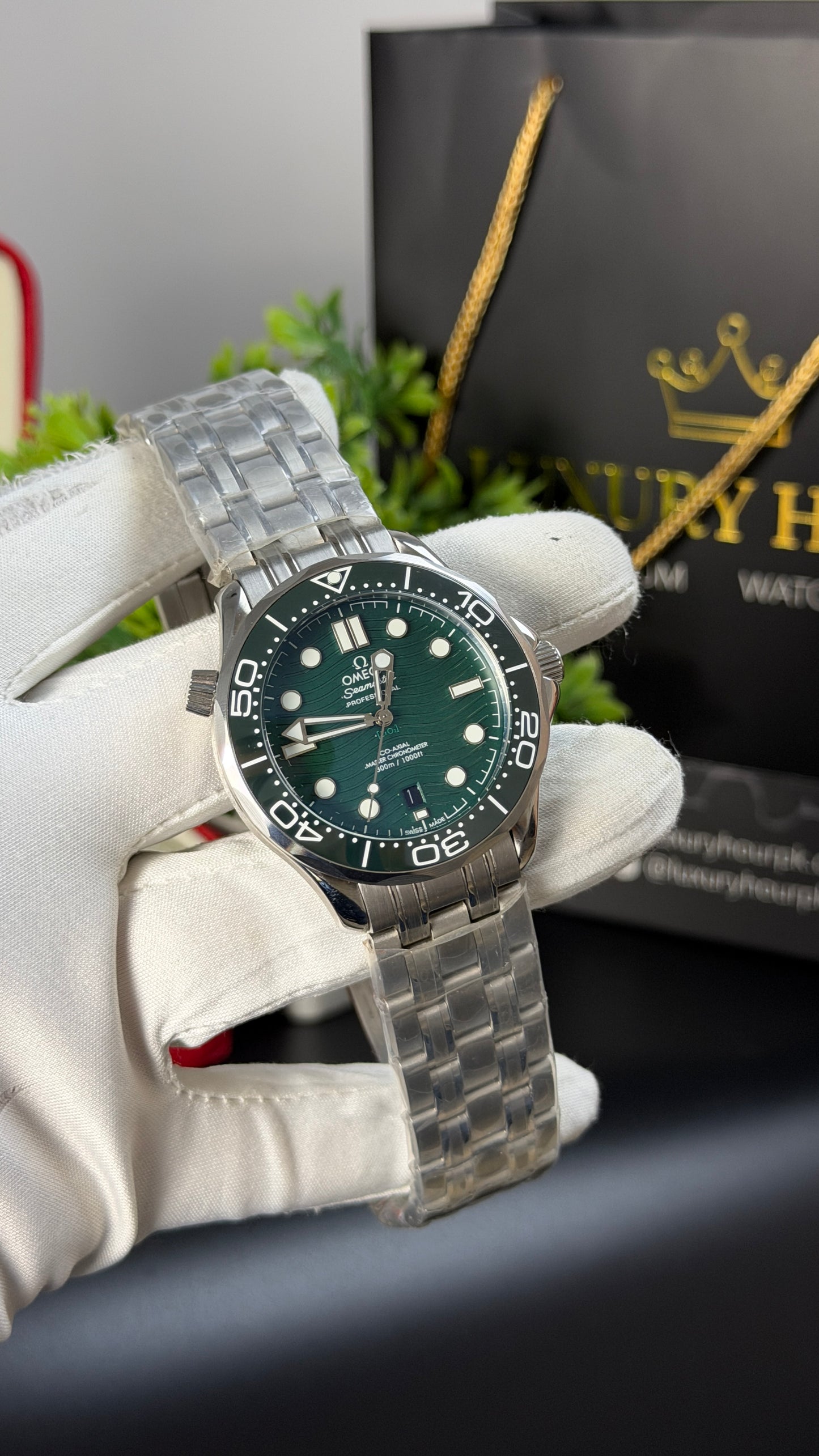 Silver with Green Dial.