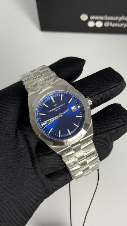 Silver with Aqua Dial.