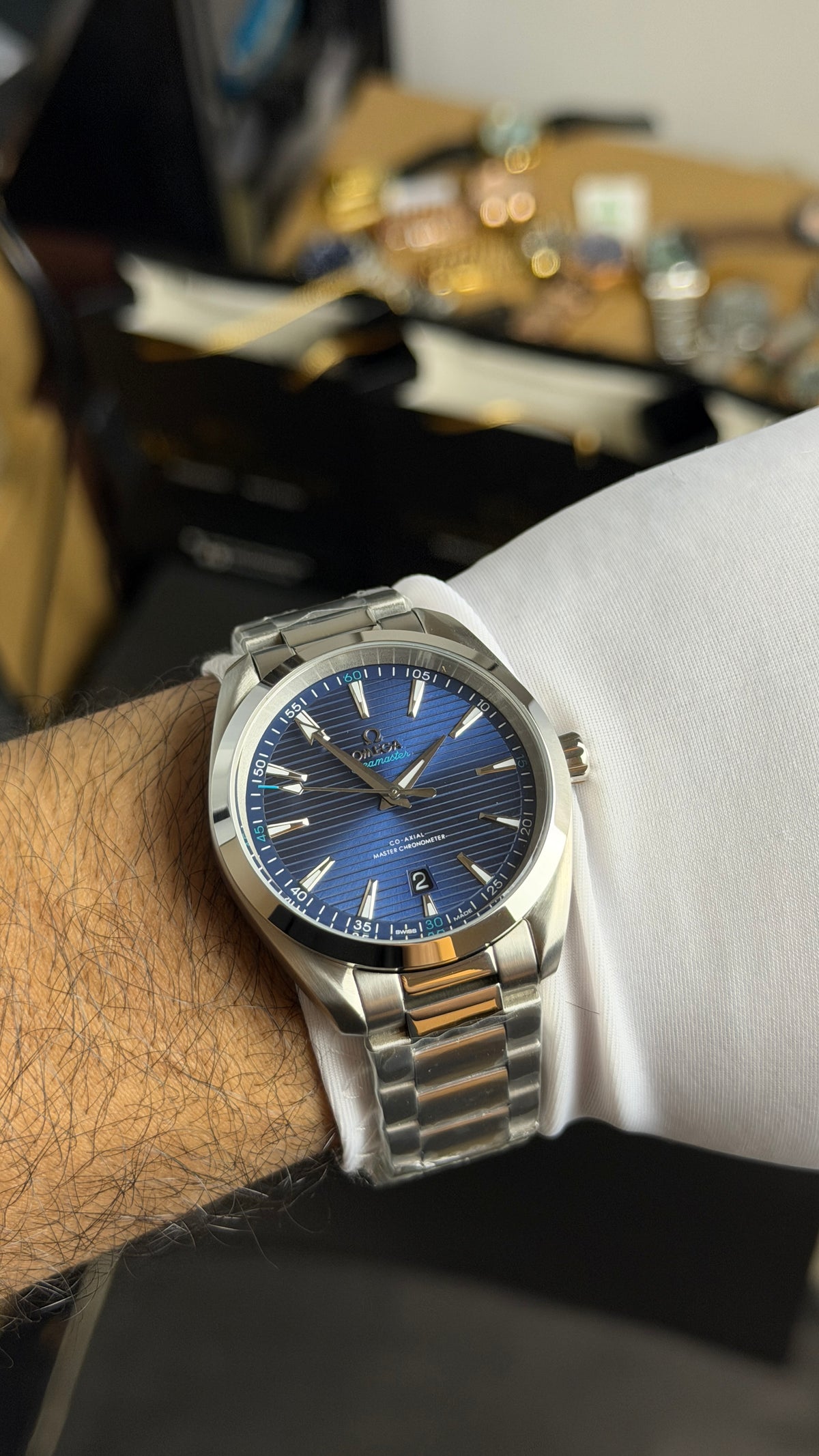 Silver with Aqua Dial.