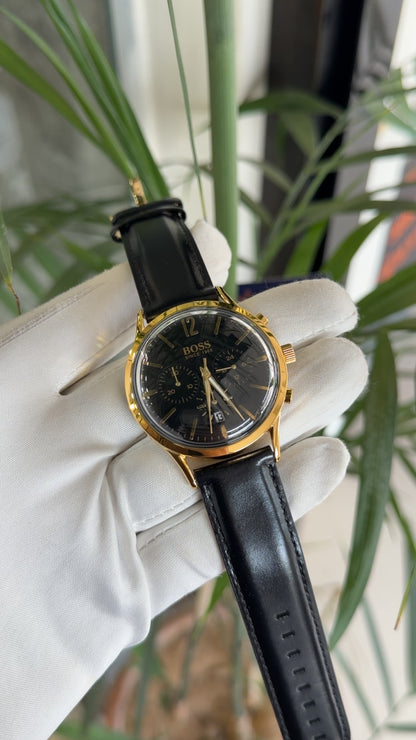 Yellow gold with black dial and black strap
