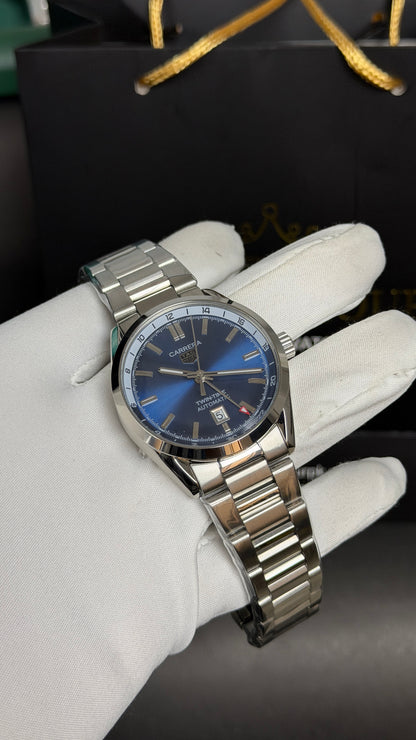 Silver with Aqua Dial.