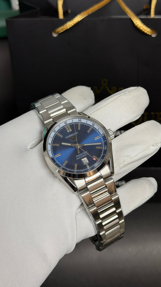 Silver with Aqua Dial.