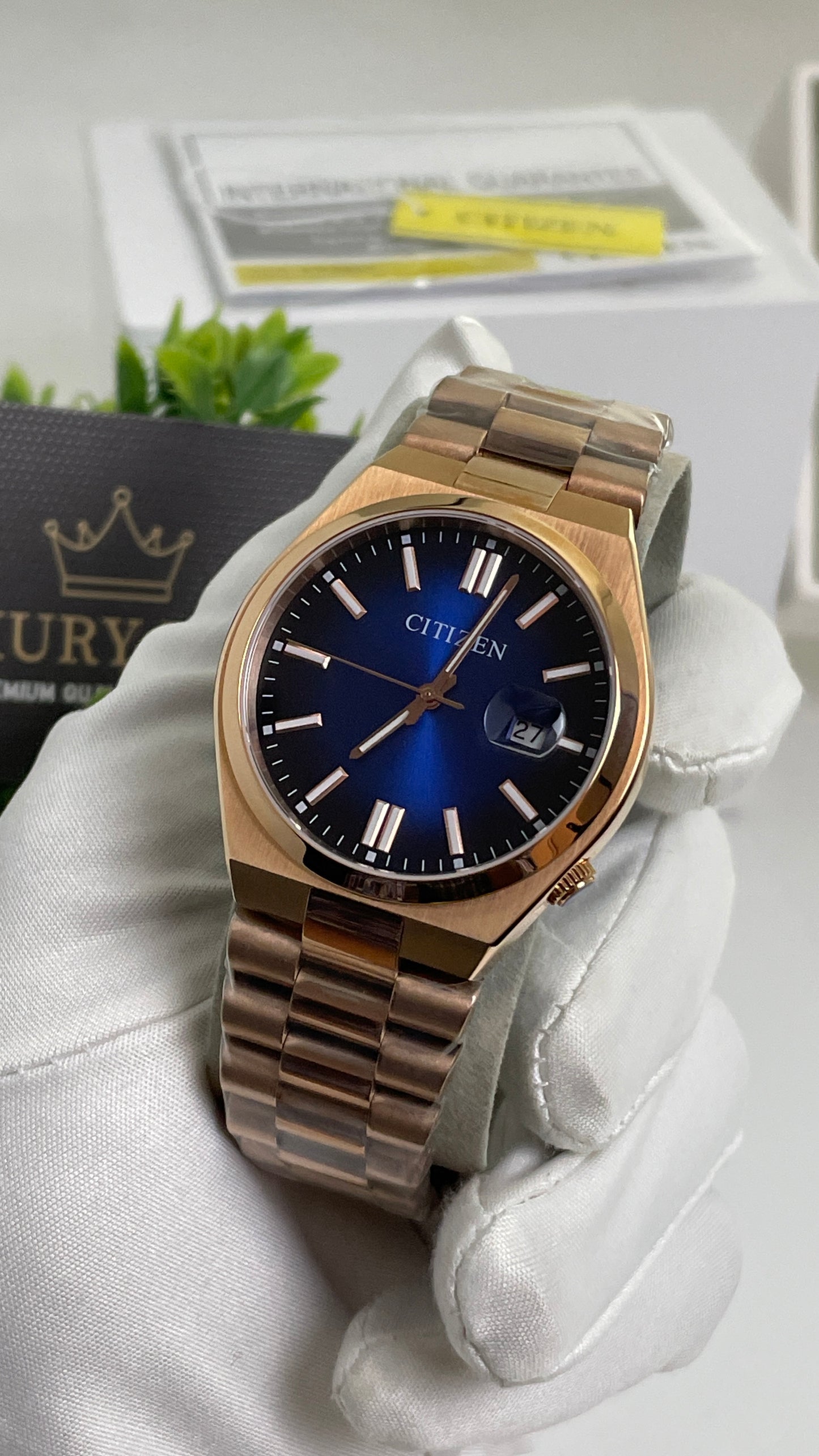 Rose Gold with Aqua Dial.