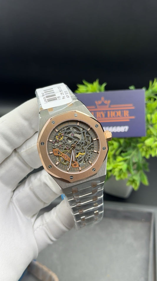 Rose gold two tone with grey dial.