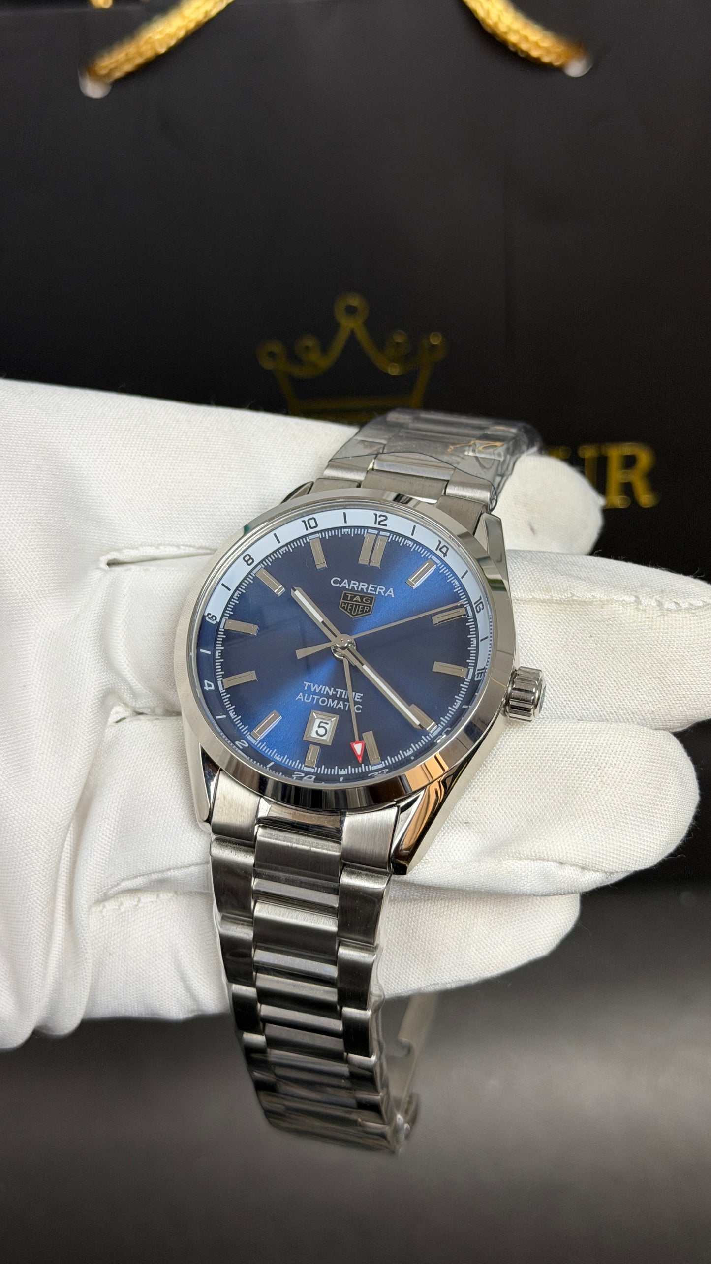 Silver with Aqua Dial.