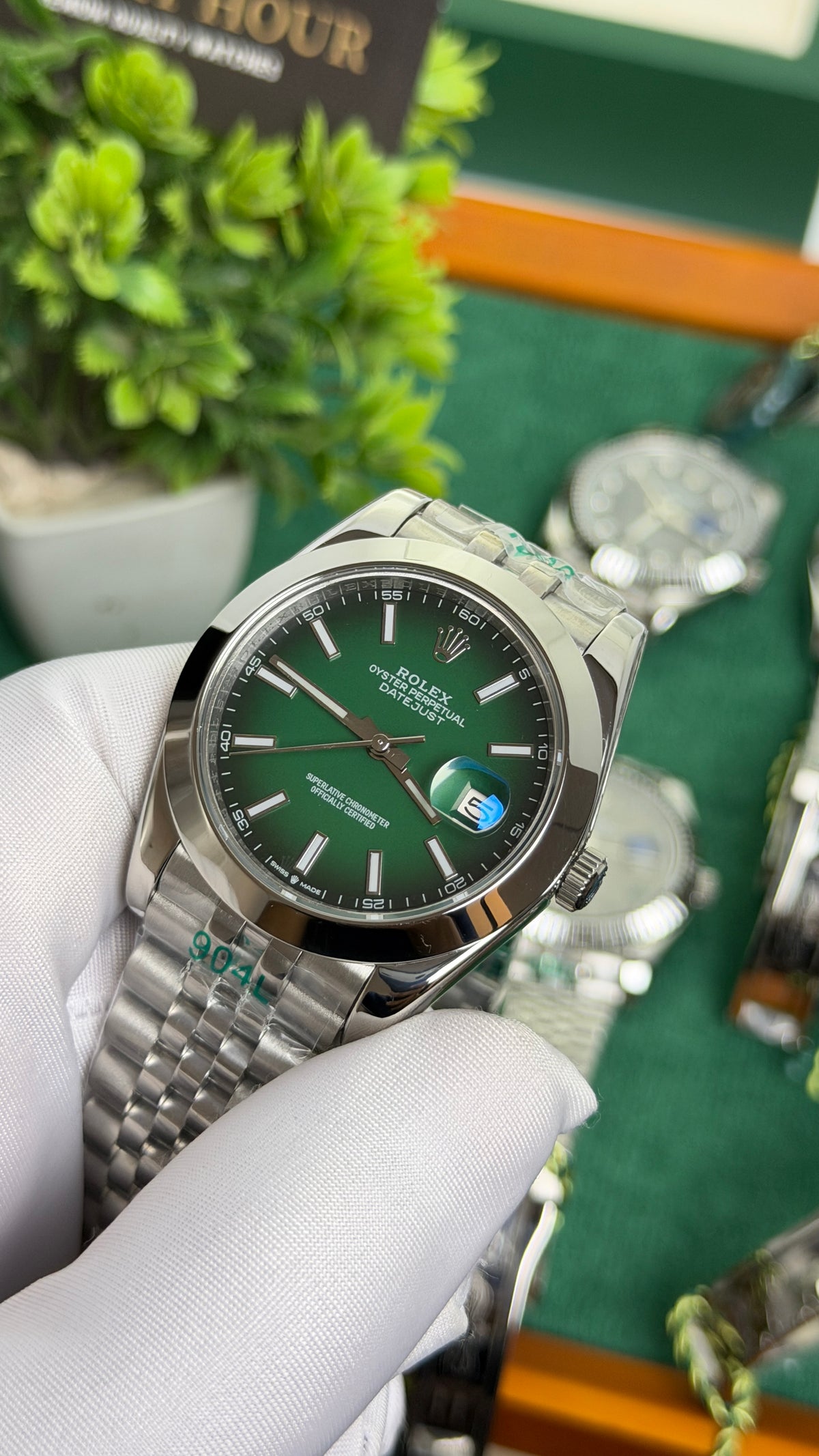 Silver with Green Dial.