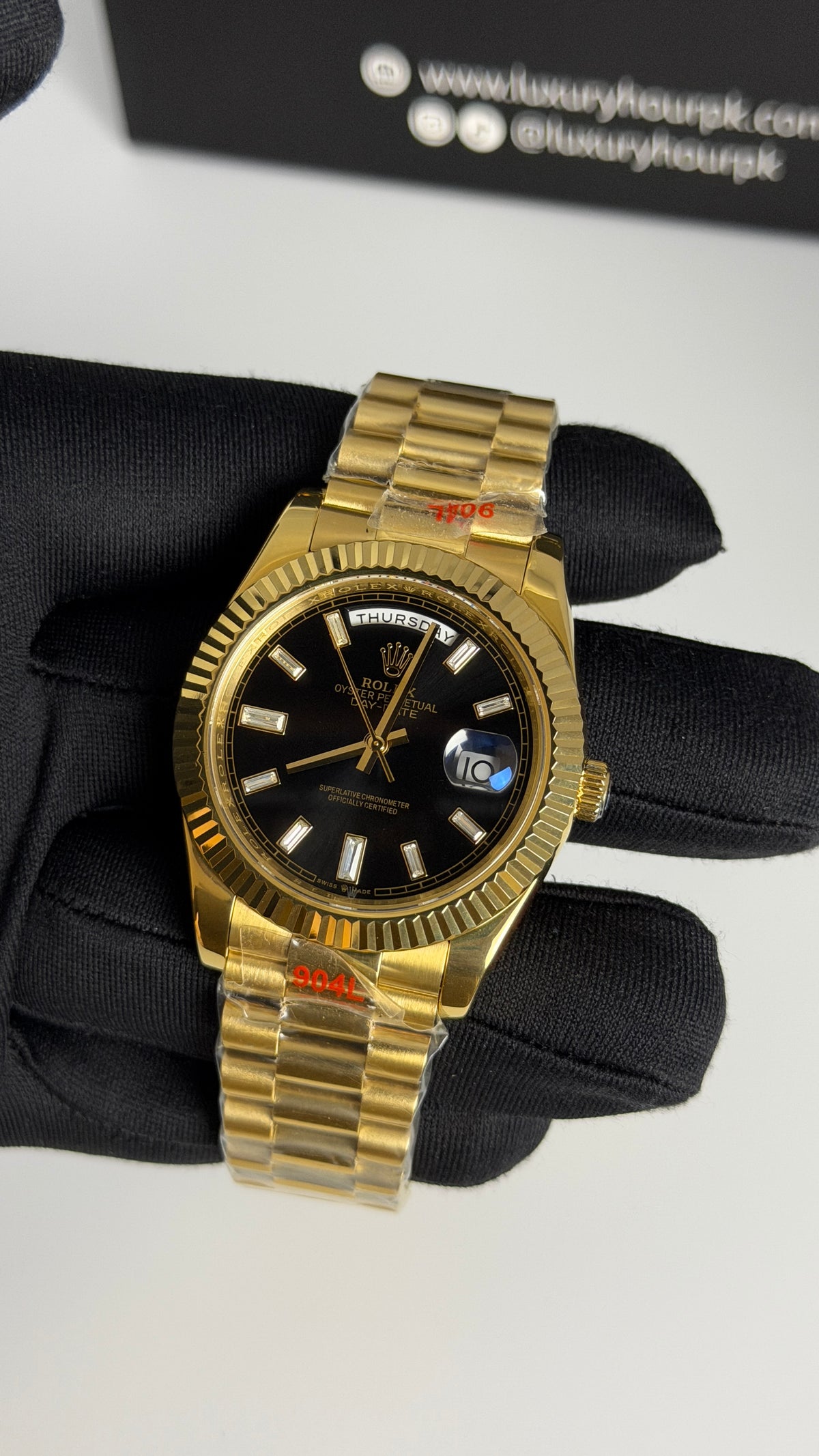 Yellow Gold with Black Dial.