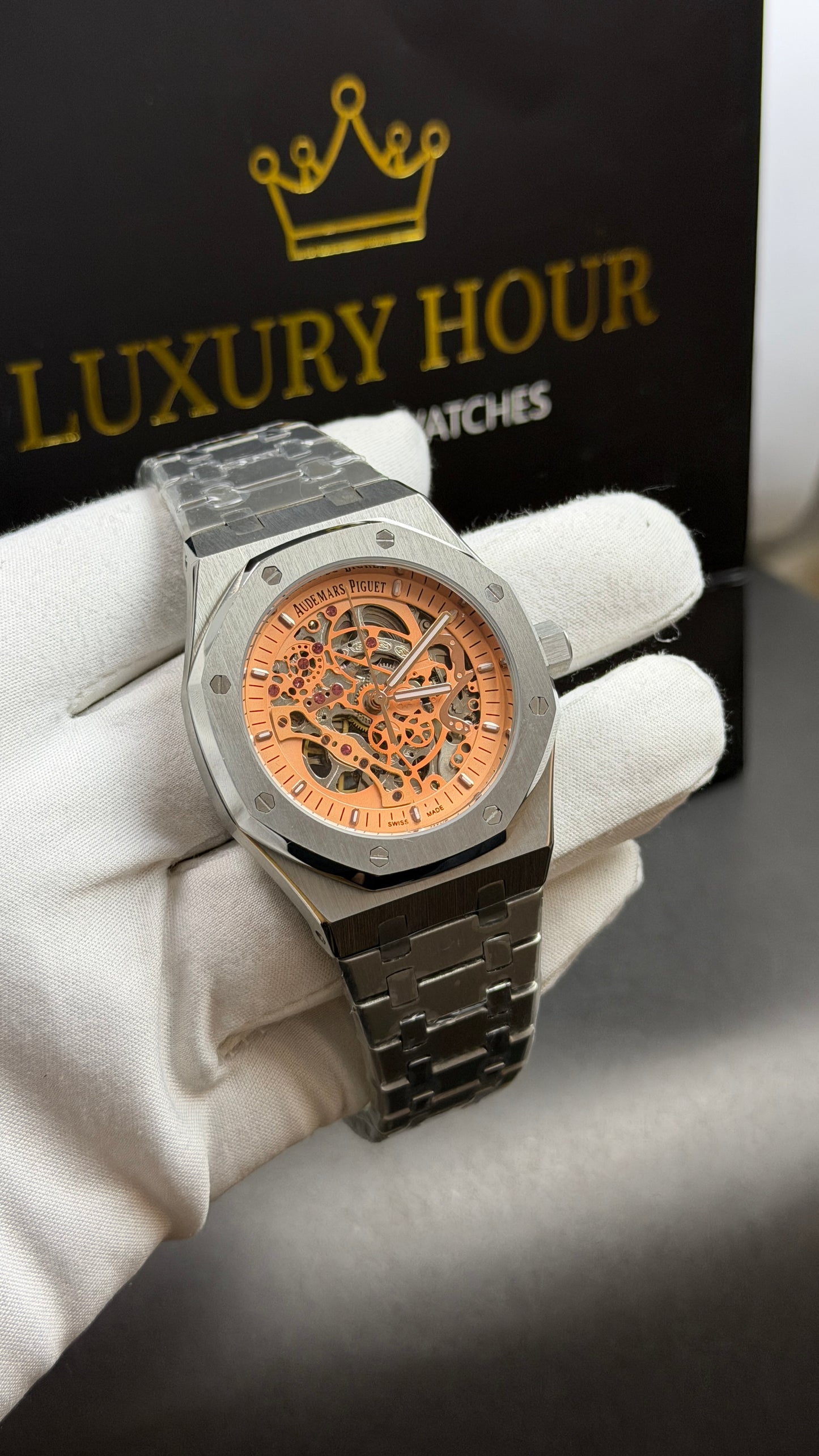 Silver with Orange Skeleton Dial.
