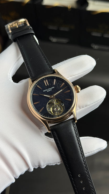 Rose Gold with Black Dial.