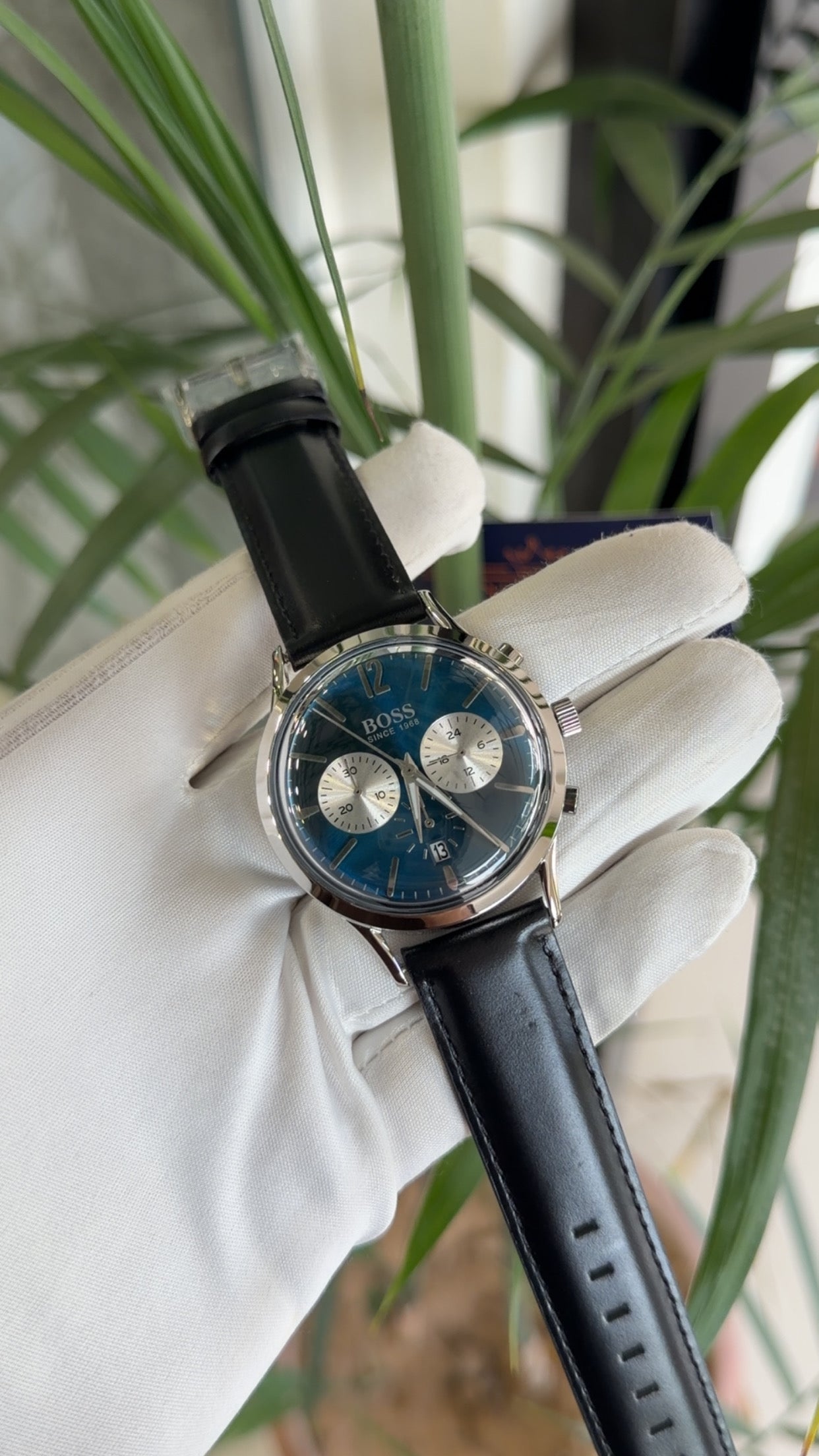 Silver with blue dial and black strap