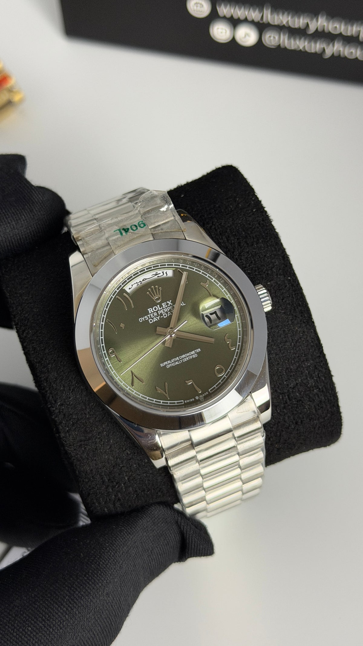 Silver with Green Dial.