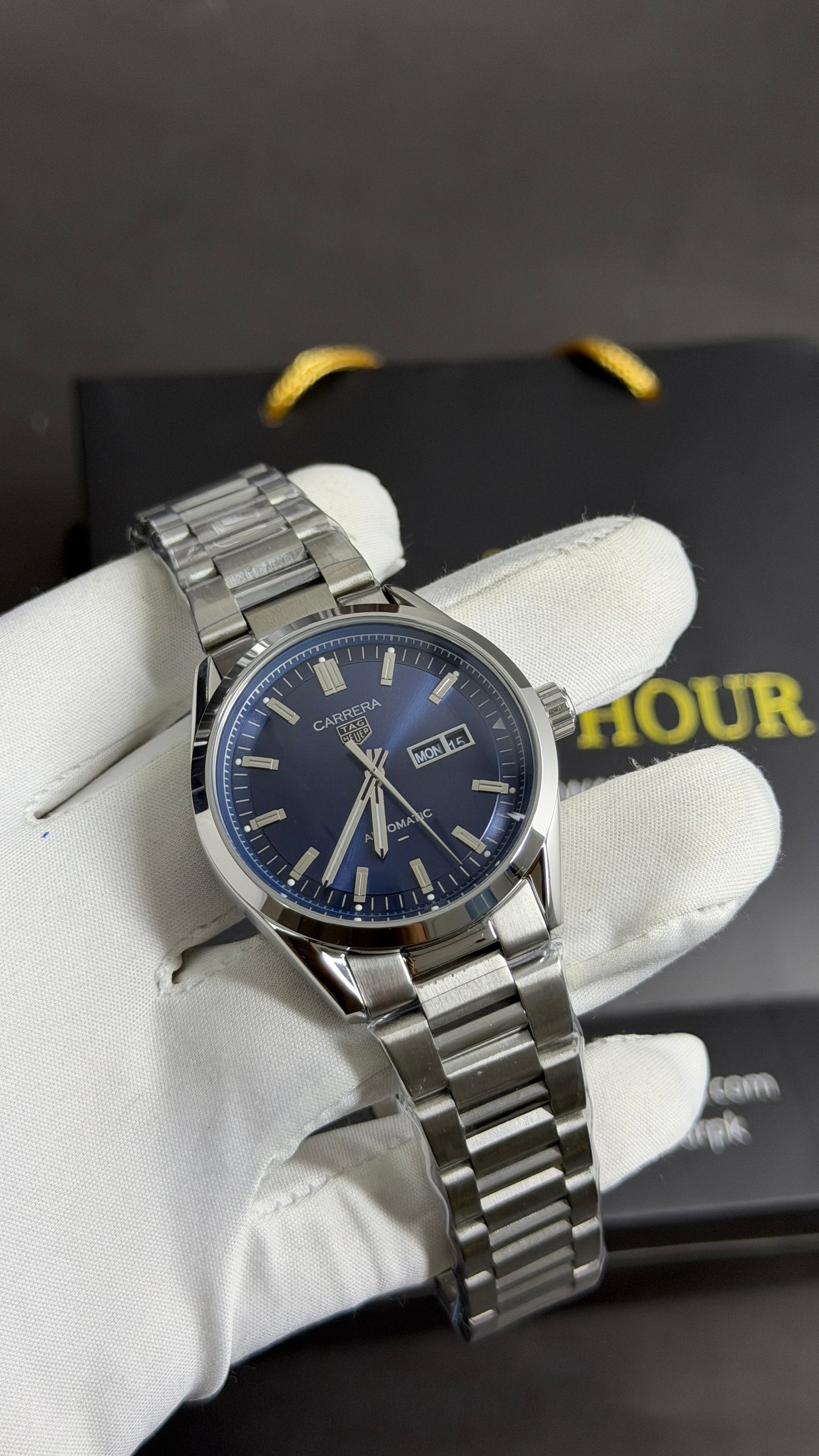 Silver with Aqua Dial.