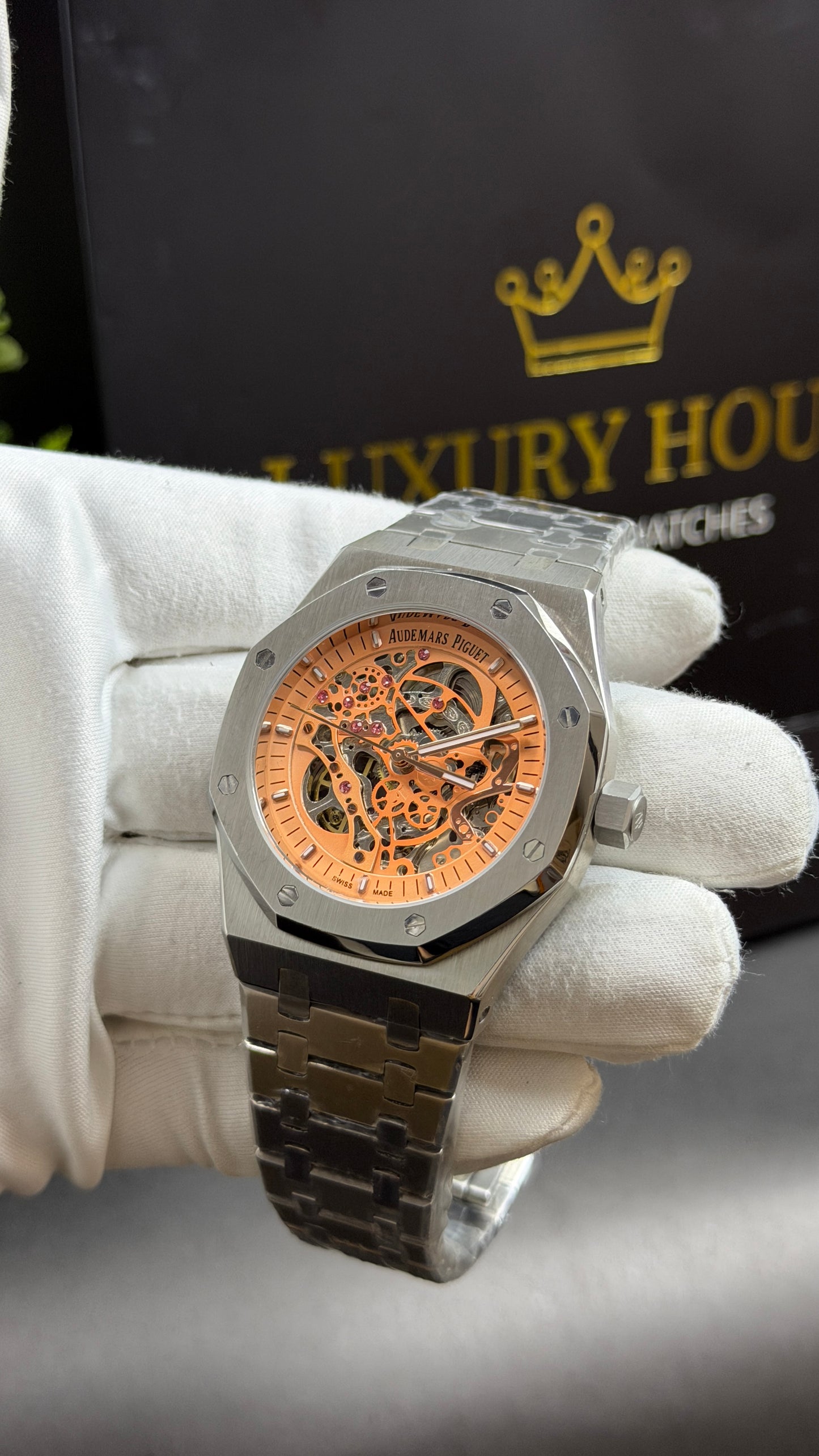 Silver with Orange Skeleton Dial.