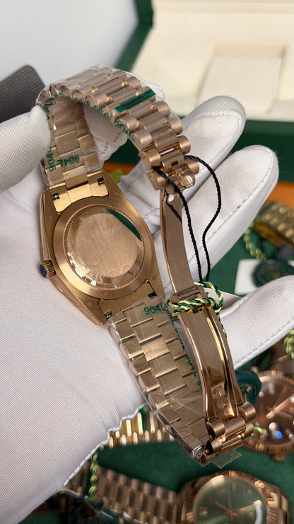 Rose Gold with Green Dial.