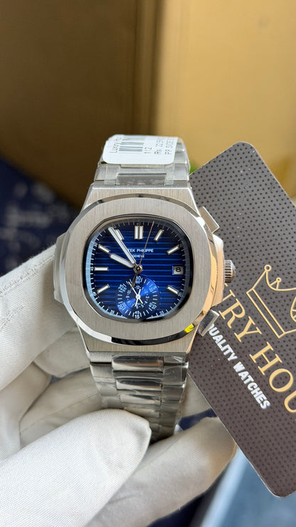 Silver with blue Dial.