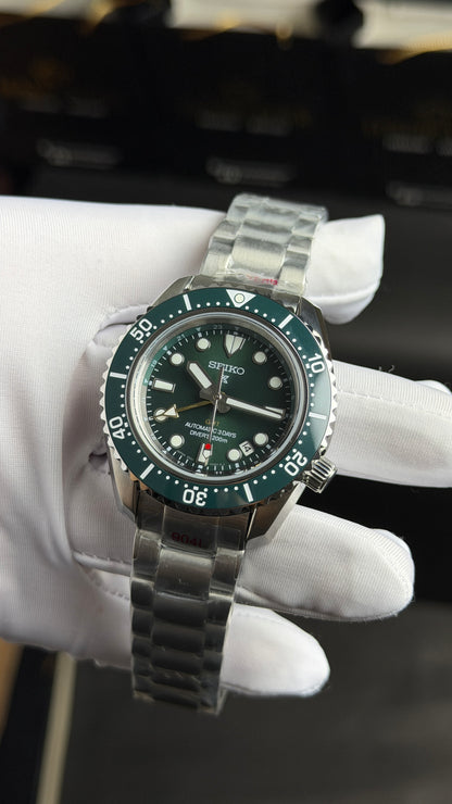 Silver with Green Dial.
