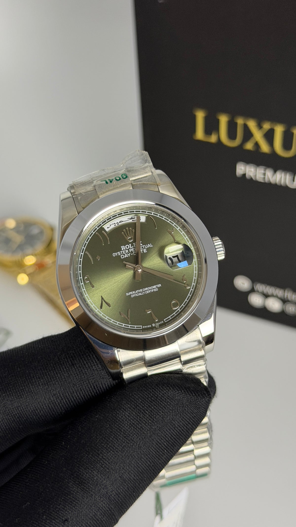 Silver with Green Dial.