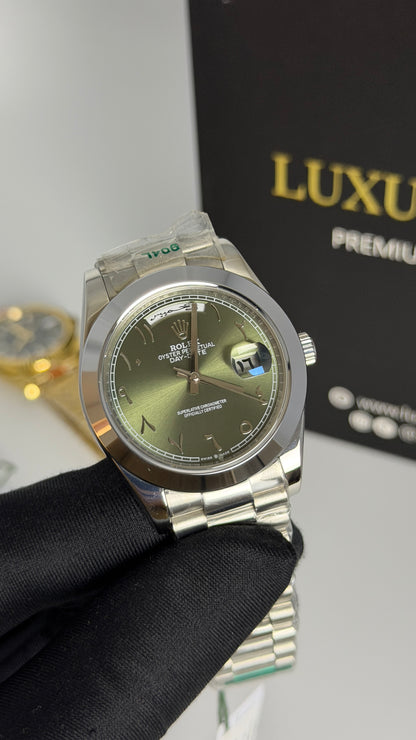 Silver with Green Dial.