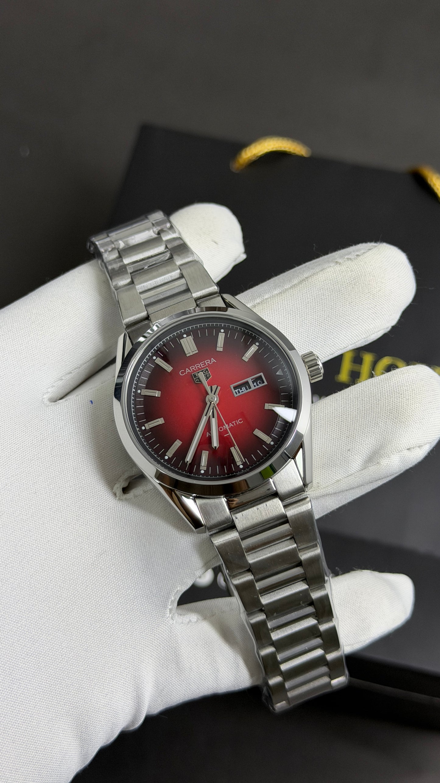 Silver with Maroon Dial.