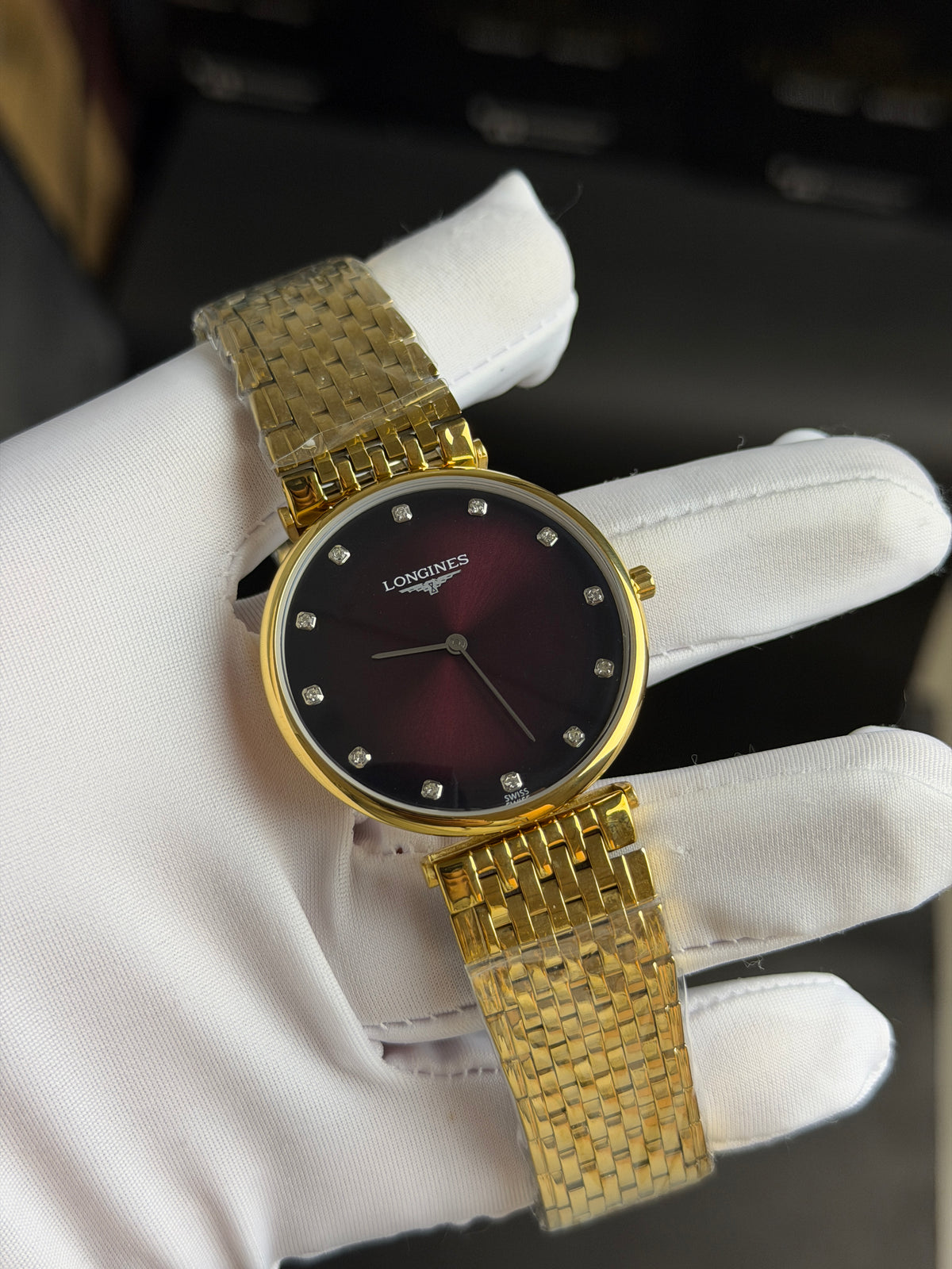 Yellow Gold with Maroon Dial.