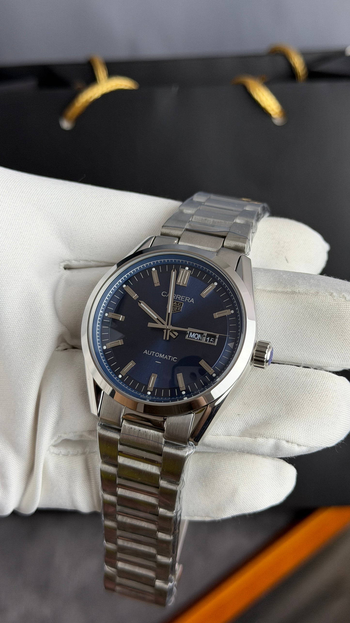 Silver with Aqua Dial.
