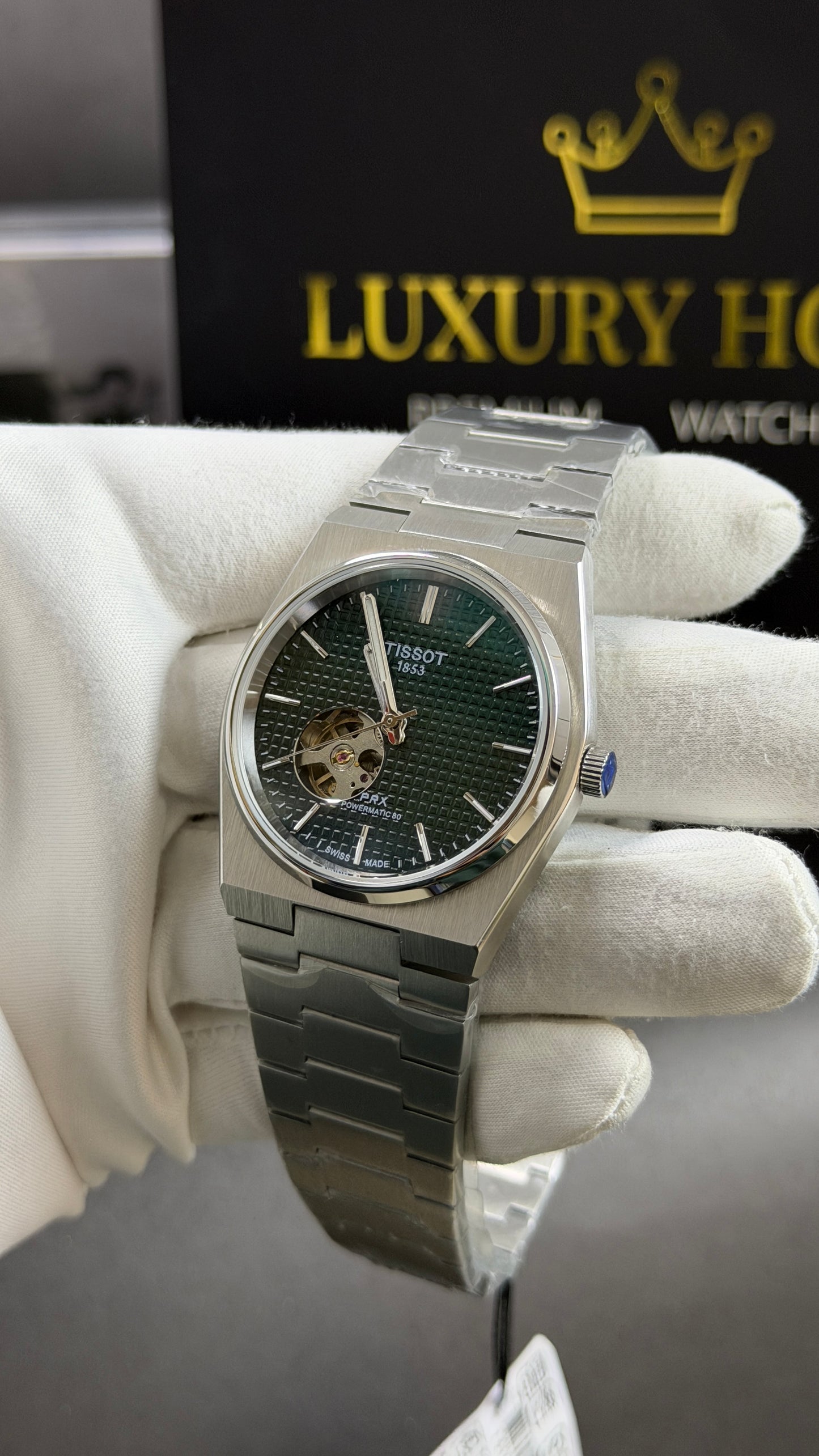 Silver with Green Dial.