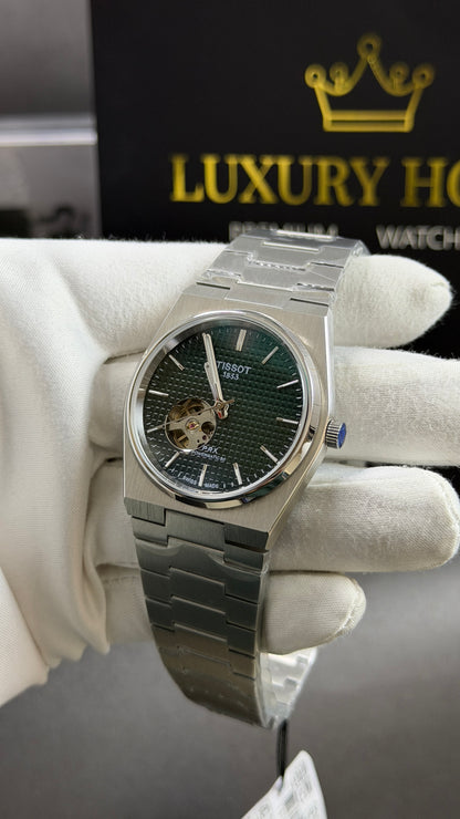 Silver with Green Dial.