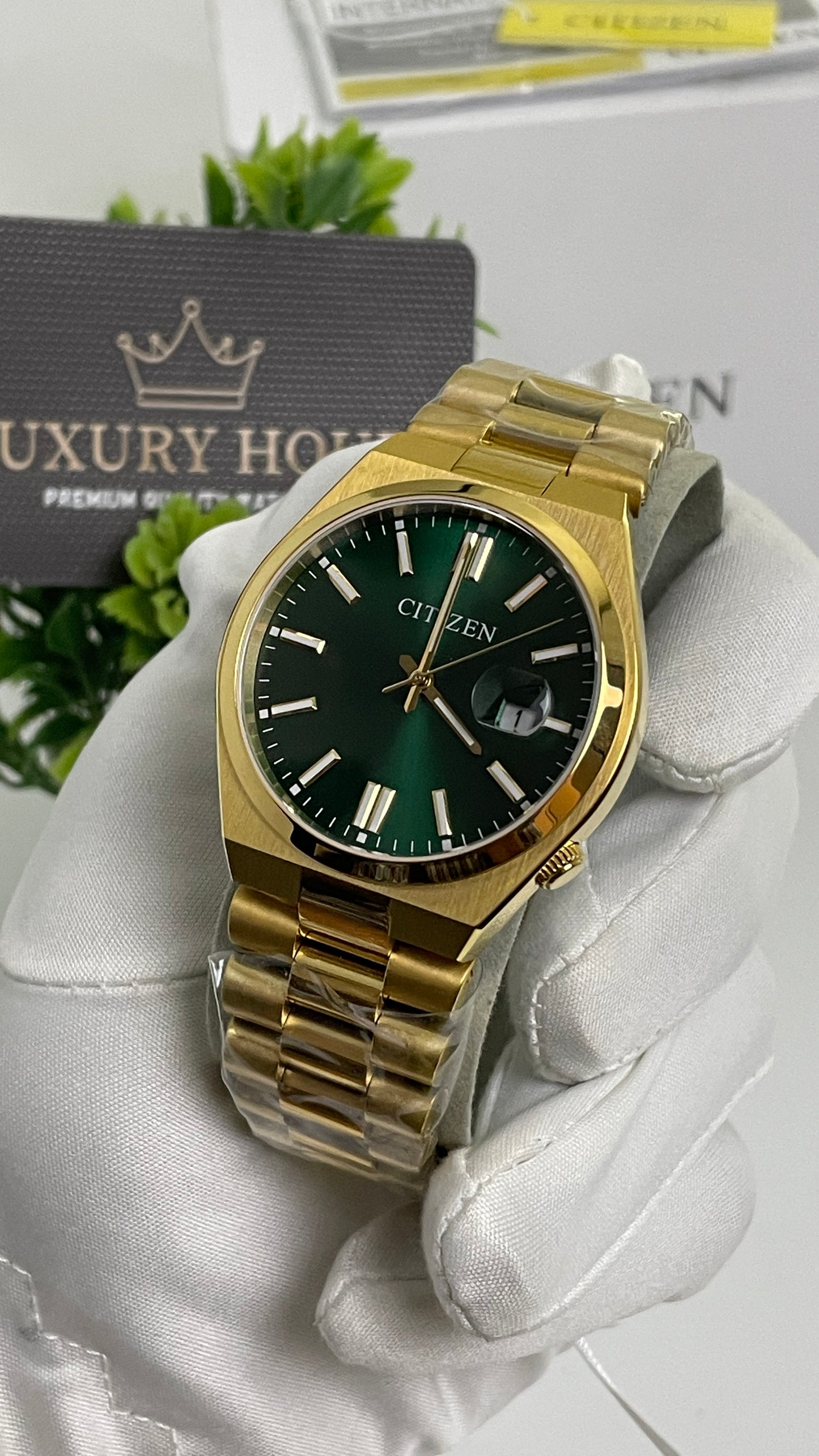 Yellow Gold with Green Dial.