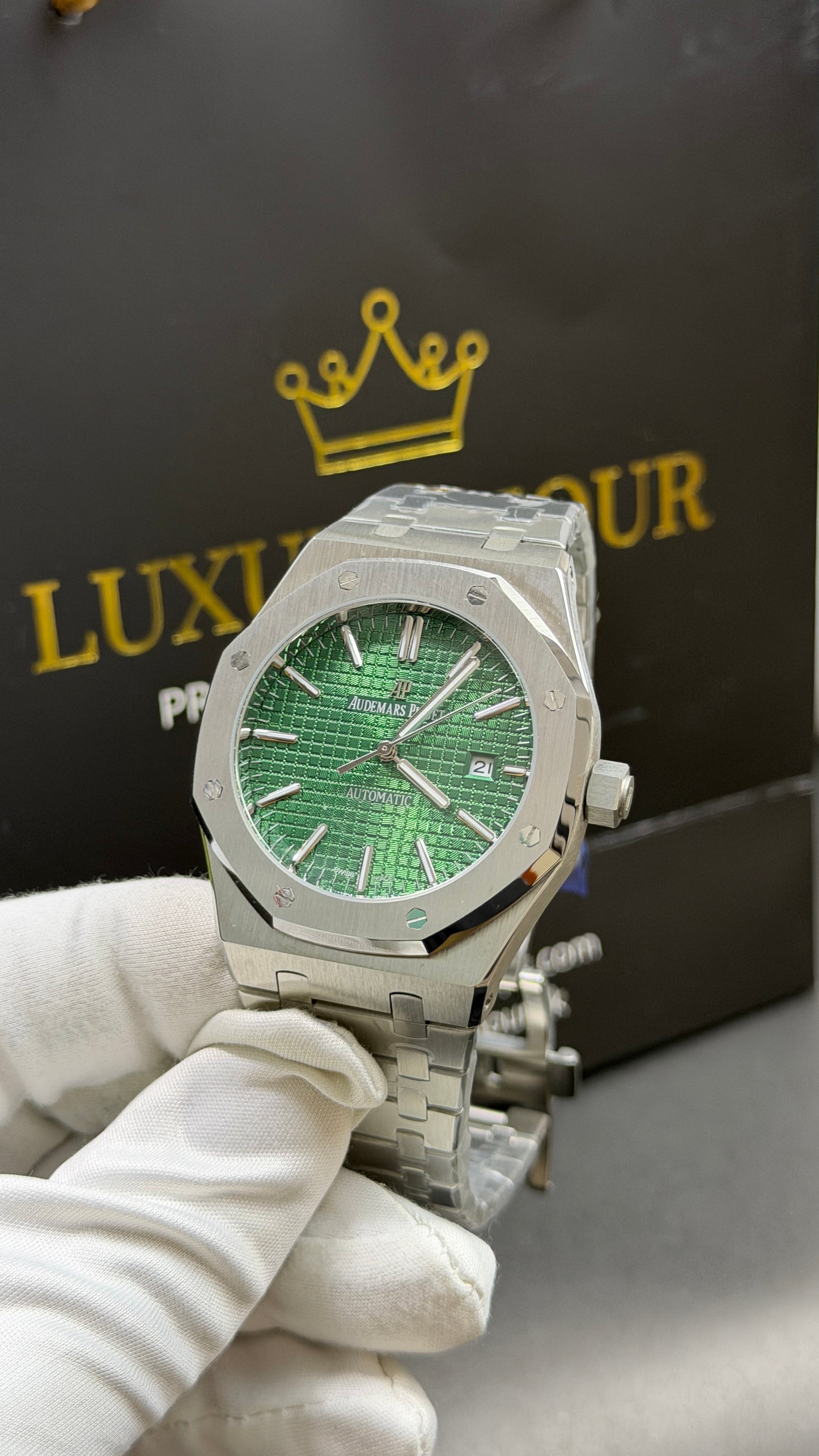 Silver with Green Dial.